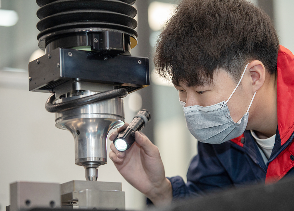 DELIXI quality control engineer inspecting precision components with advanced testing equipment