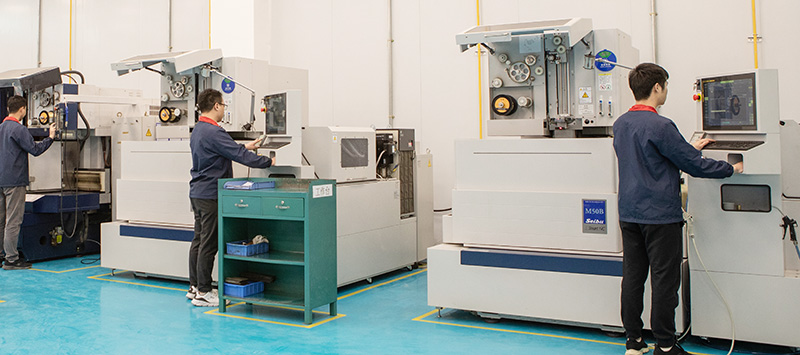 DELIXI technician using state-of-the-art equipment for precision mold fabrication and quality control