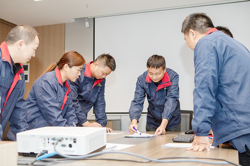 DELIXI innovation team brainstorming next-generation smart manufacturing processes at tech center